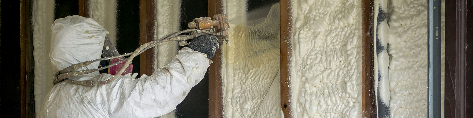 Adding spray insulation between studs inside a home